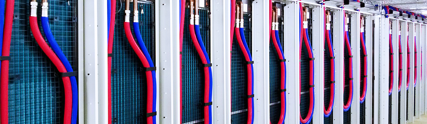 Hydraflex DataCool hoses installed at a rear-door heat exchanger — application photograph, not identification of an individual HQDC part number.