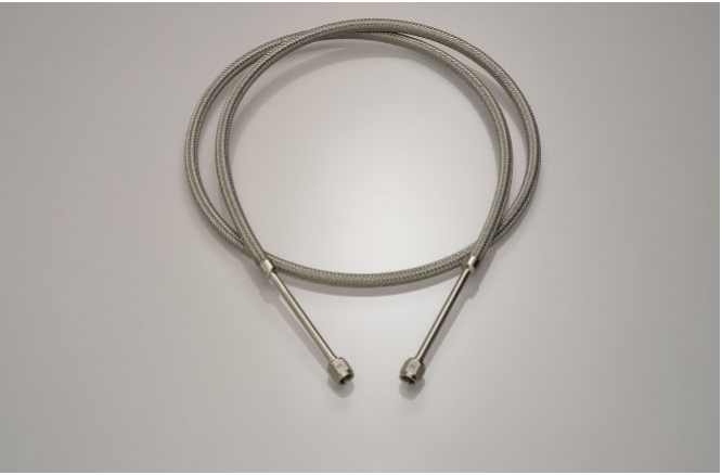 Penflex braided metal hose assembly with paired VCR-style end connectors — manufacturer brochure, physical page 4; shown configuration only.