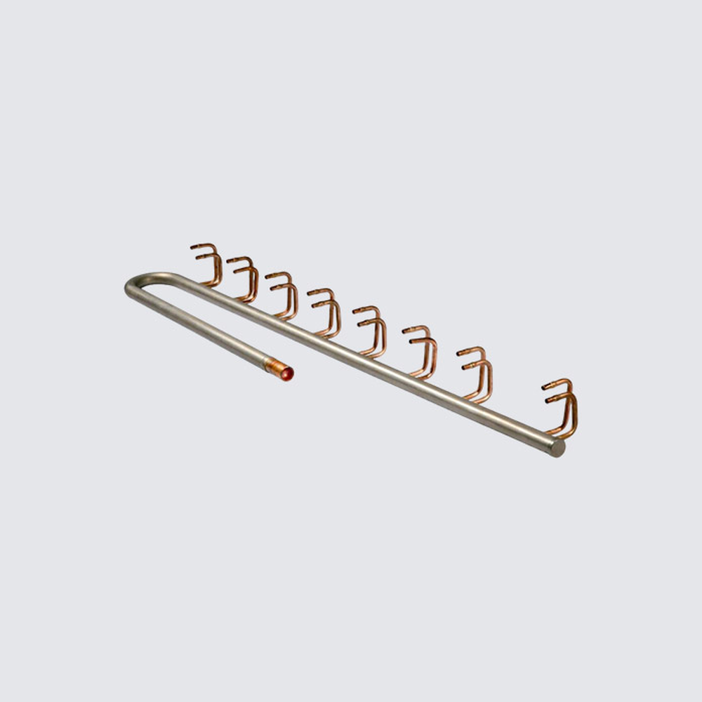 Deya multi-outlet metal branch header with formed small-bore takeoffs, shown as a custom distribution example.
